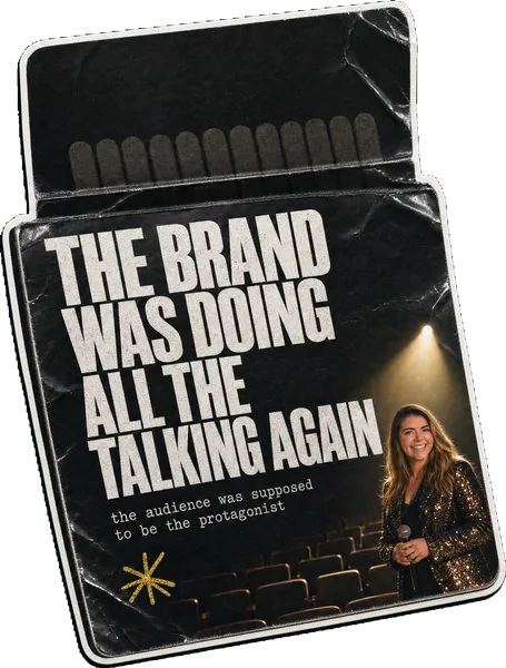 A matchbook sticker reading THE BRAND WAS DOING ALL THE TALKING AGAIN, with Rosie Arrowsmith in a spotlight on an empty theatre stage.