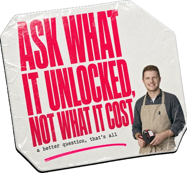 A price-tag sticker reading ASK WHAT IT UNLOCKED, NOT WHAT IT COST, with Alex Morris in a shopkeeper's apron.